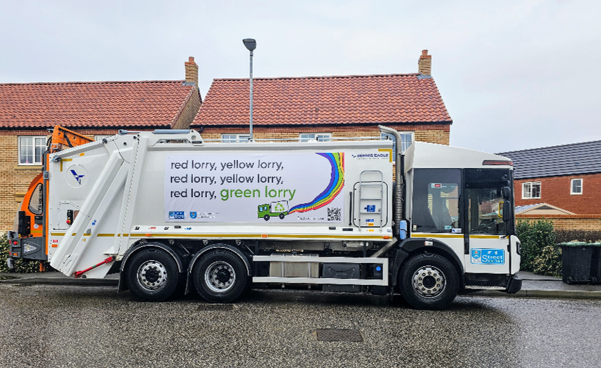 Recycling lorry with the words Red lorry, Yellow lorry, Green lorry printed on the side
